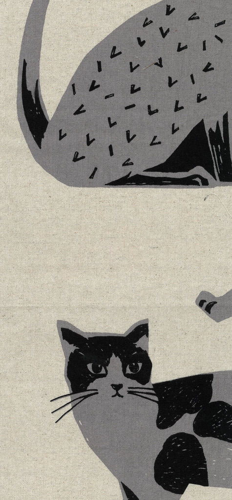 Illustration of a cat with a patterned tail on a natural fabric