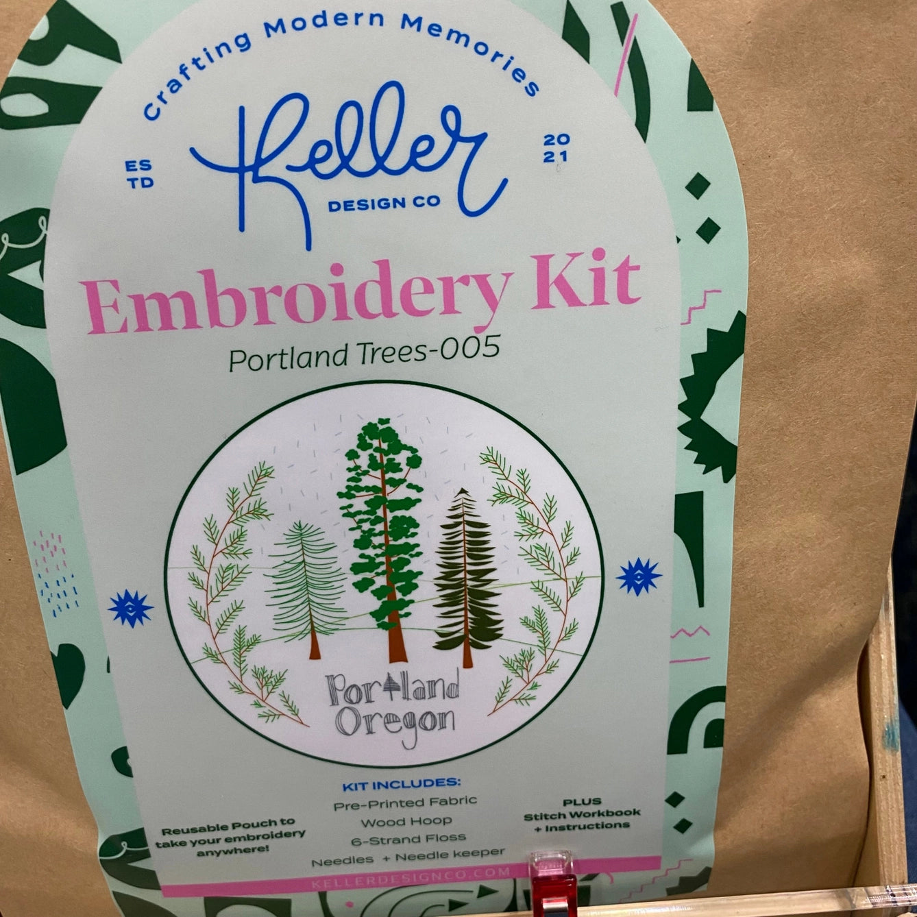 Keller Design Co embroidery kit packaging with trees design on a cardboard background