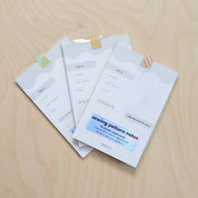 Sewing pattern notes on a wooden surface