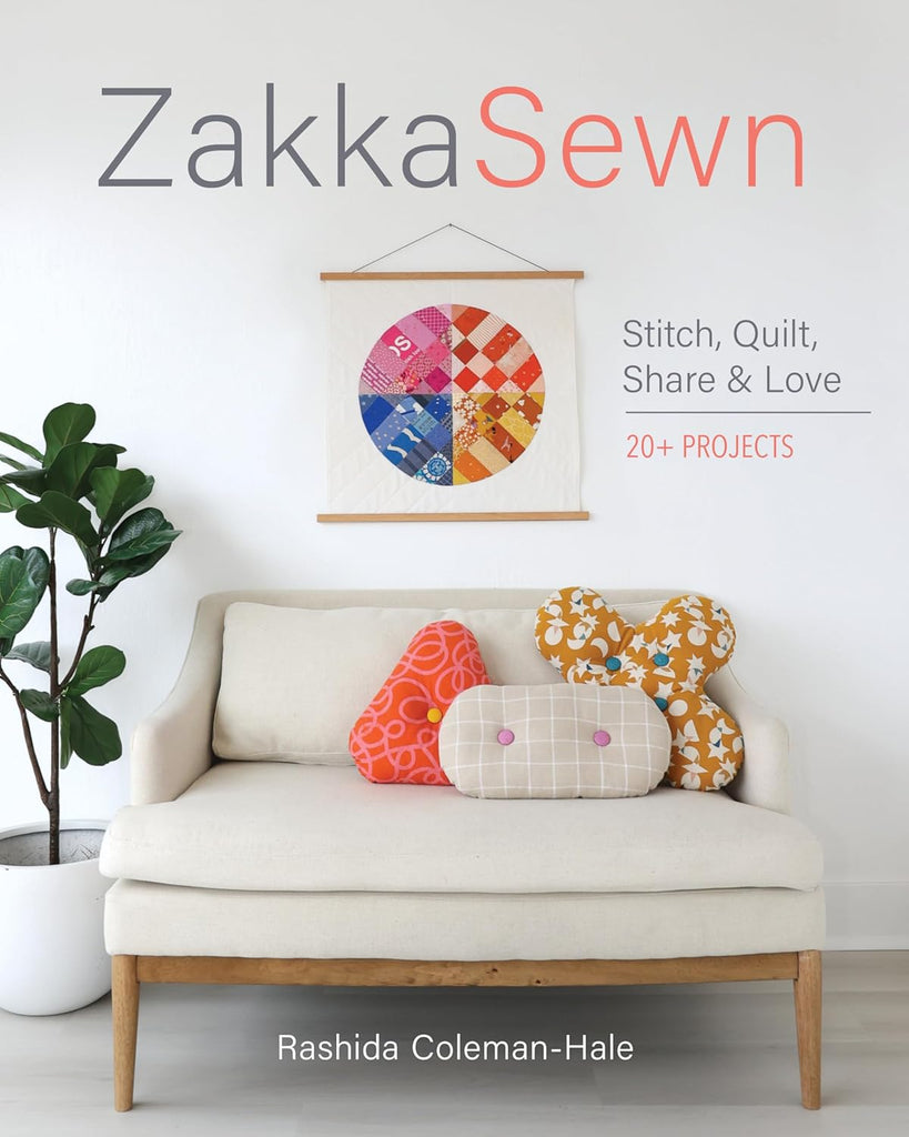Book cover of 'Zakka Sewn' with a couch and colorful pillows on a white background