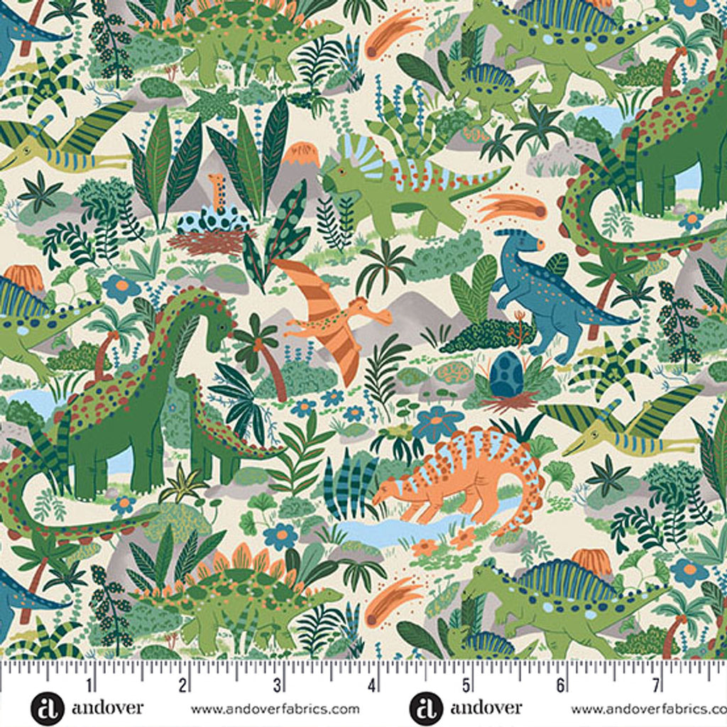 Fabric swatch with multi- colored dinosaurs and plantsona cream background with a ruler at the bottom.