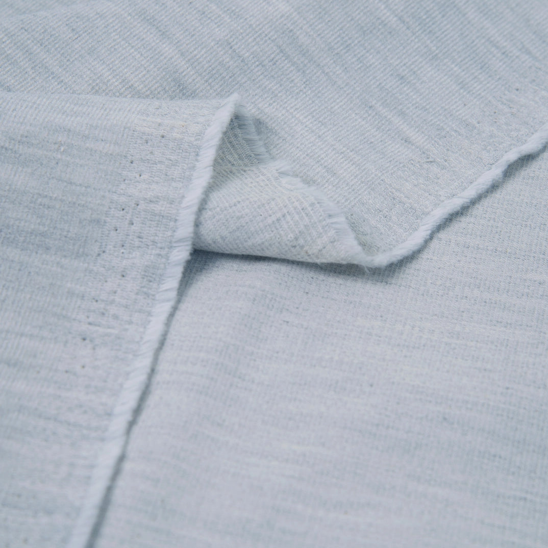 Close-up of light blue textured fabric