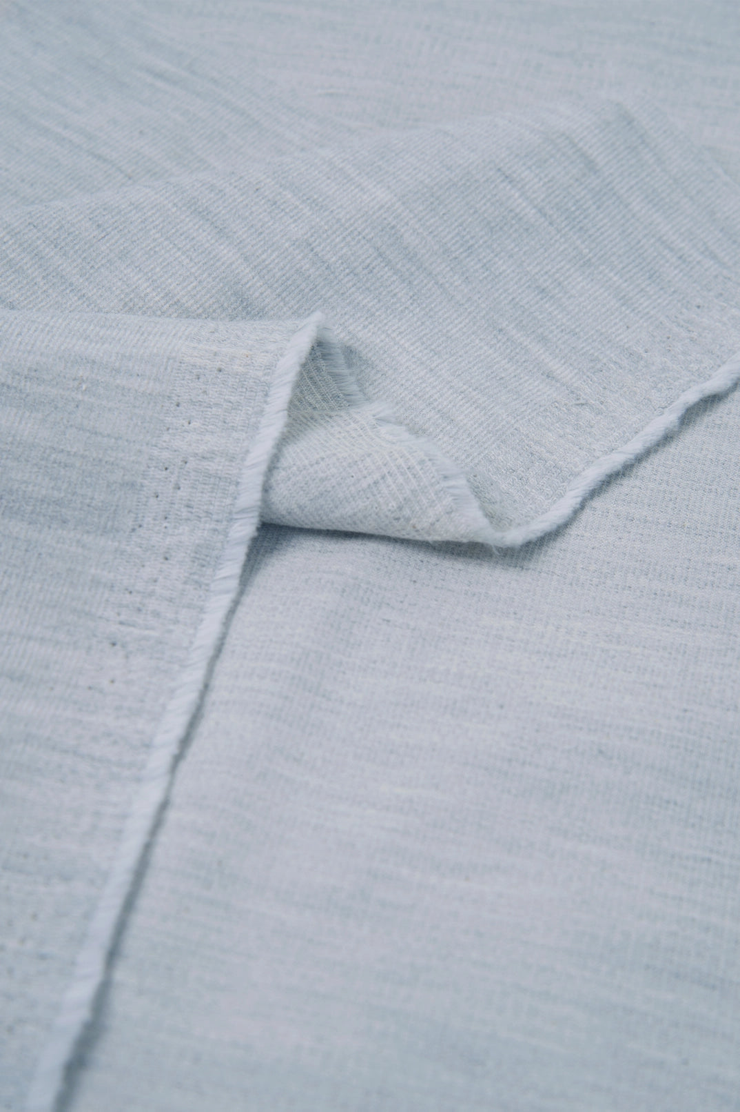 Close-up of light blue textured fabric