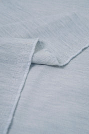 Close-up of light blue textured fabric
