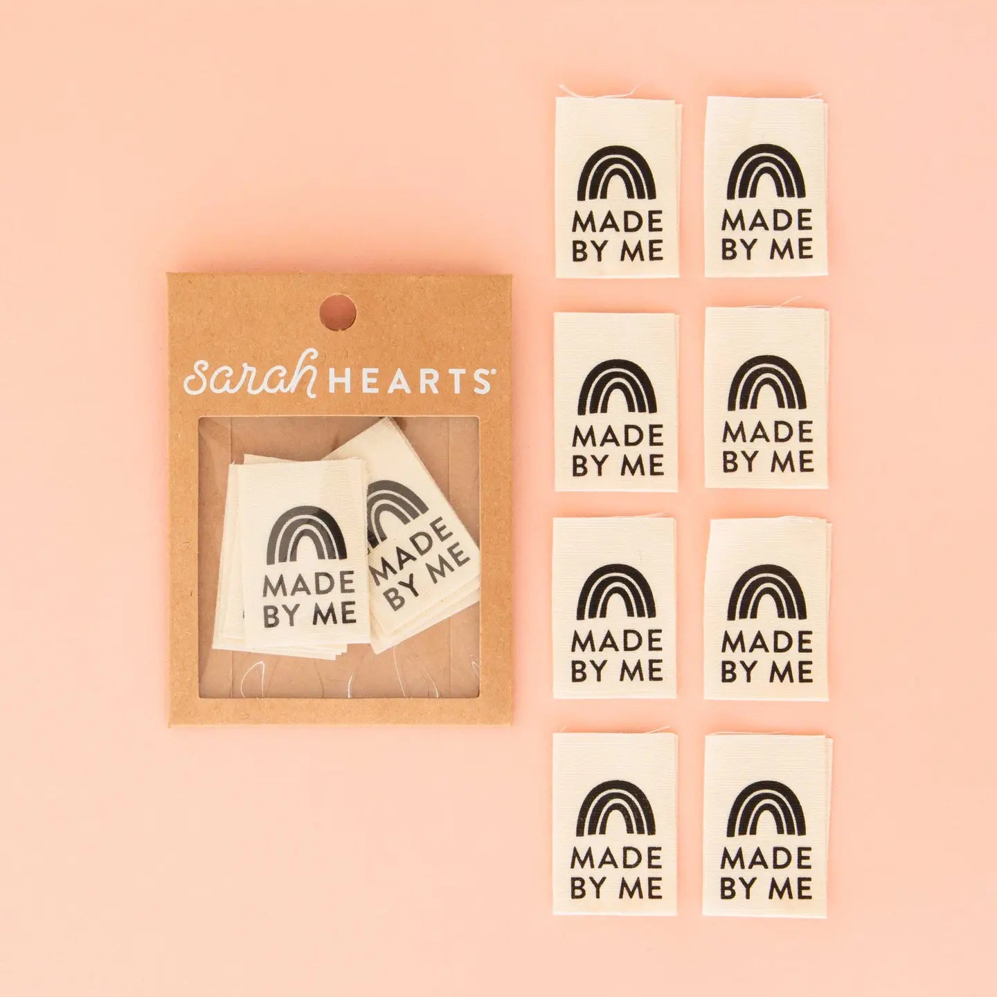 Packaging of 'Made by Me' labels with a pink background