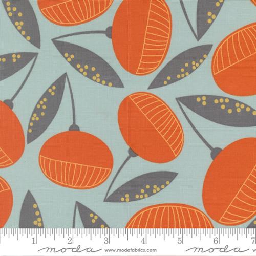 Fabric with round orange flowers on a seaglass background
