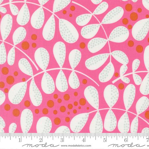 Fabric with a pink background and white and orange leaf pattern, featuring Moda label.