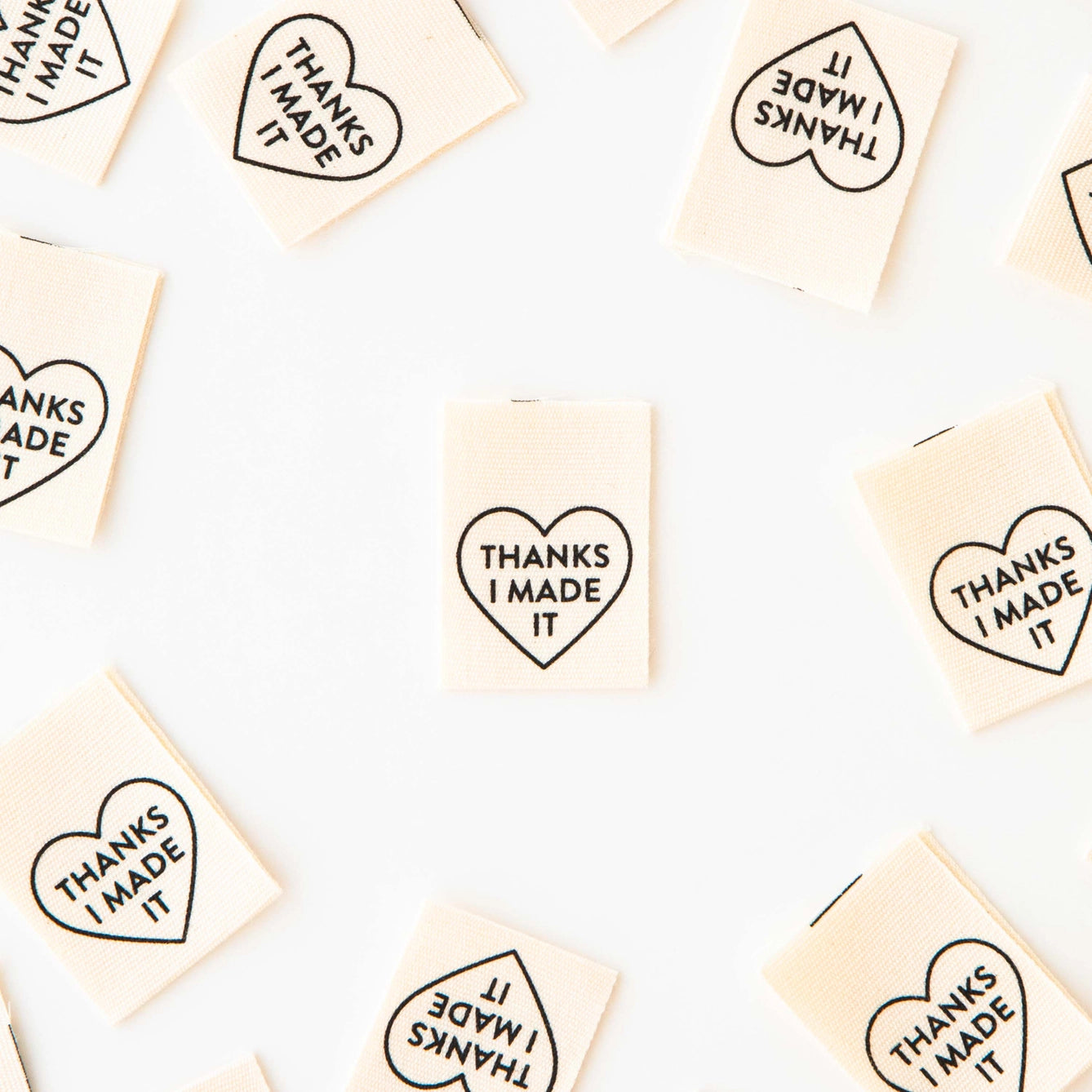 Small rectangular tiles with heart-shaped text 'THANKS I MADE IT' arranged in a grid.
