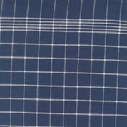 Close-up of blue fabric with white checkered pattern