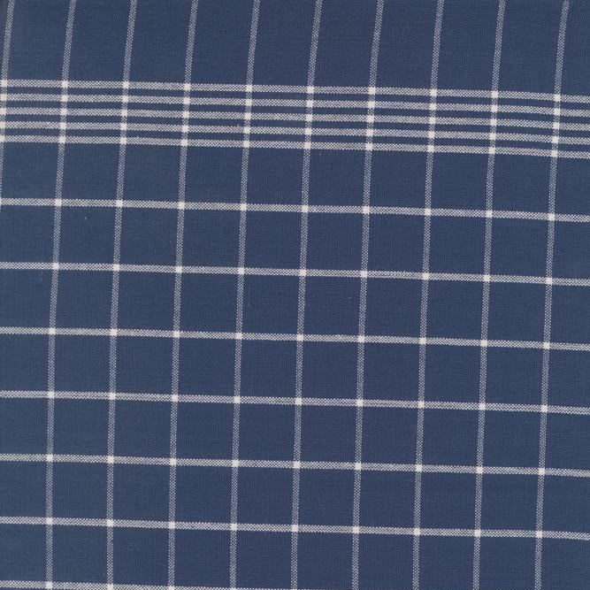 Close-up of blue fabric with white checkered pattern