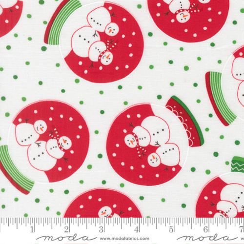 Fabric with red and green christmas-themed snowglobes and snowmen.