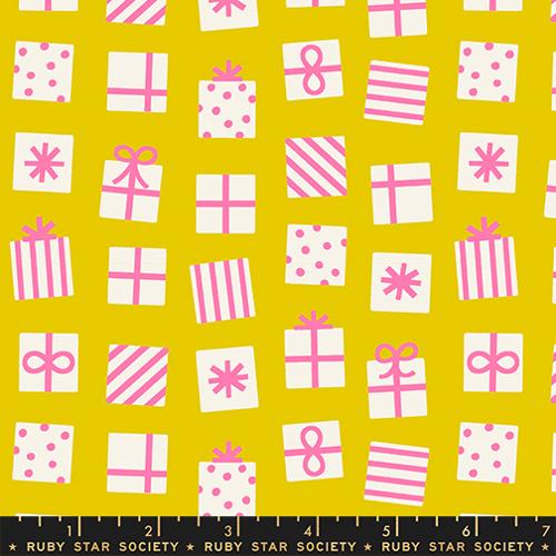 Fabric pattern of pink and white gift boxes and bows on a yellow background with a Ruby Star Society label.