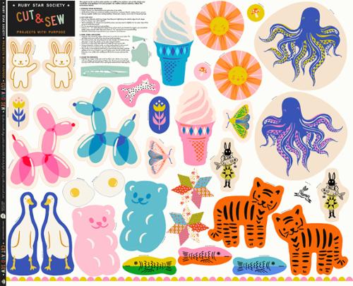 Collection of colorful cut-out shapes including animals, flowers, and other designs on a white background.