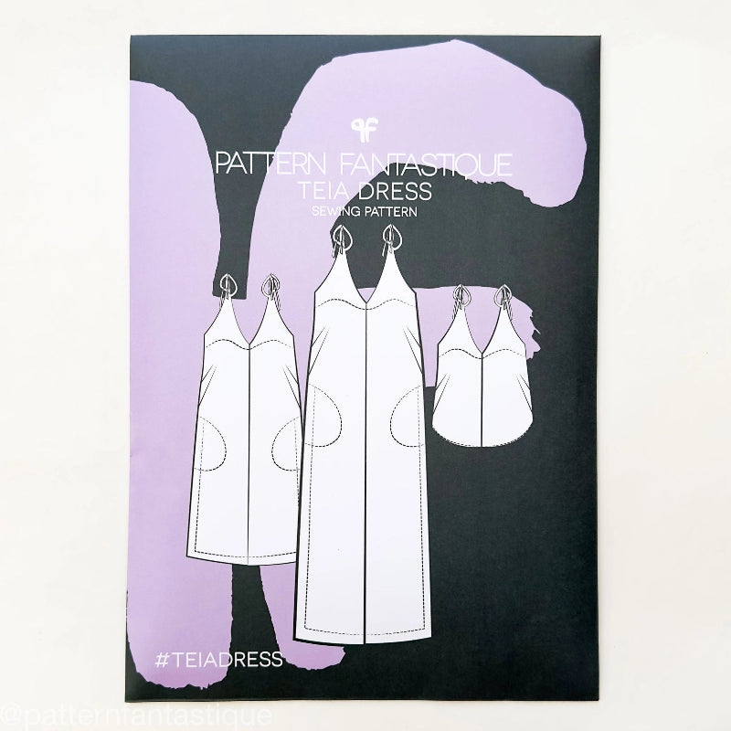 Pattern Fantasticè tea dress packaging with illustrations of dresses on a black and purple background.
