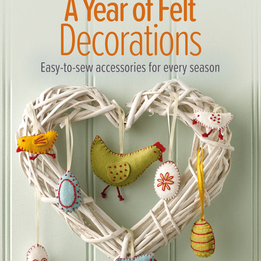 Book cover of 'A Year of Felt Decorations' with a decorative wreath and felt birds on a light background.