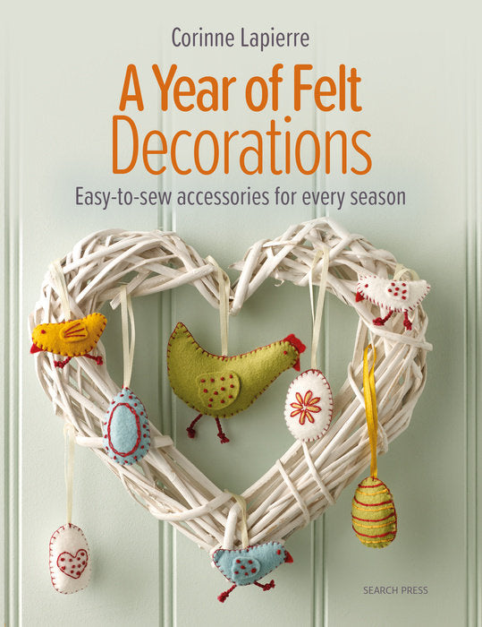 Book cover of 'A Year of Felt Decorations' with a decorative wreath and felt birds on a light background.