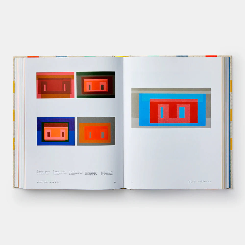 Open book displaying colorful geometric art on a white background