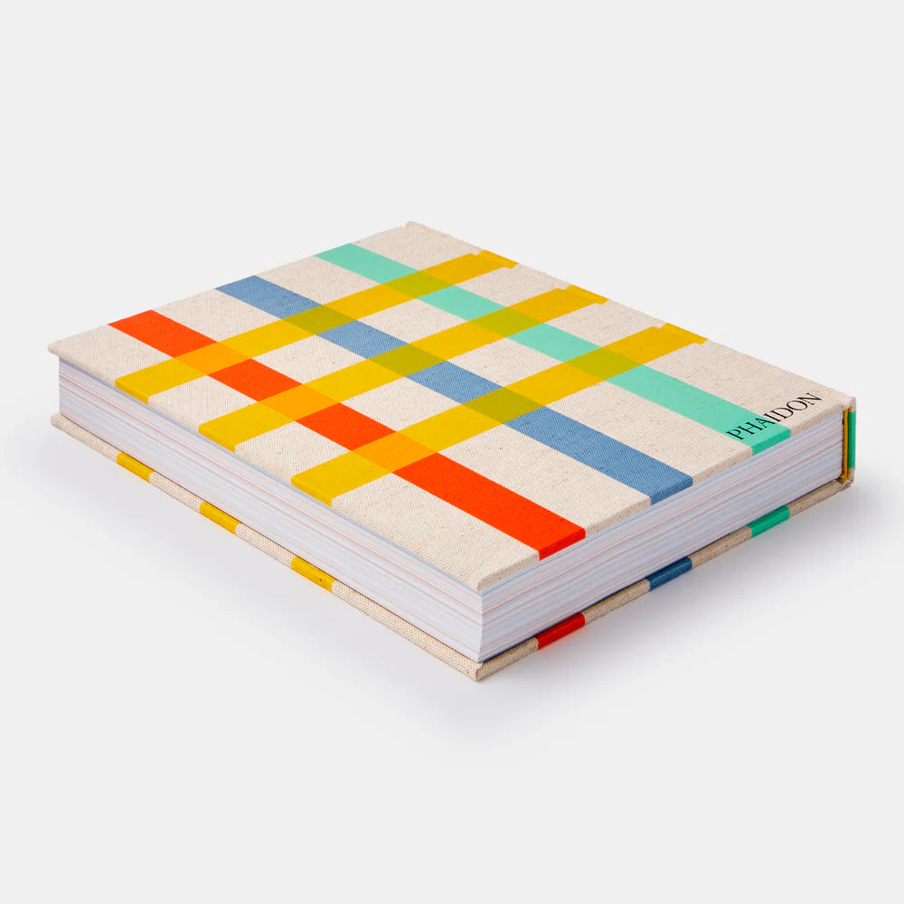 Colorful geometric-patterned notebook on a white background