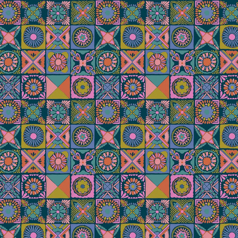 Fabric with vibrant colorful quilt designs on a dark blue background