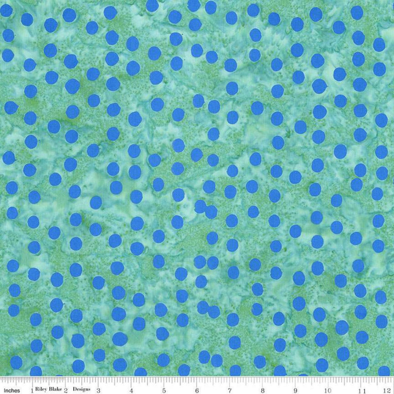 Fabric with blue polka dots on a green background
