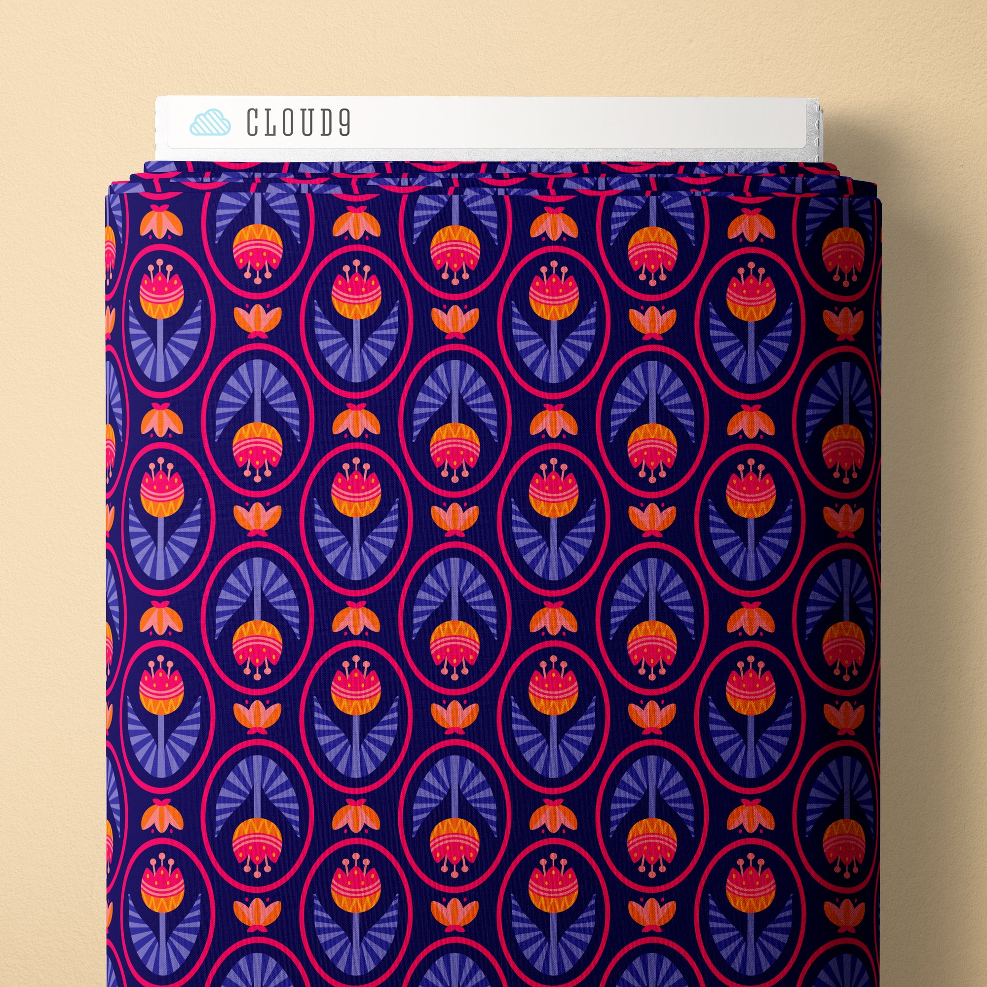 Fabric with a bright pink, orange, and purple tulip print, and a navy background