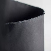 Close-up of a textured black fabric swatch.