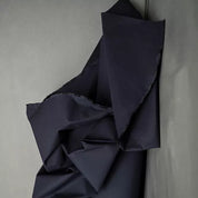 Dark blue fabric on a gray background