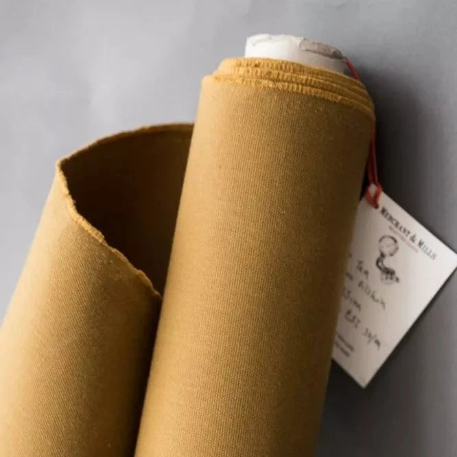 A roll of heavyweight organic cotton dry oilskin in tan 