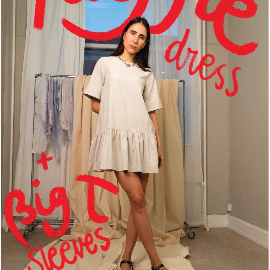 Person wearing a white dress with ruffle details in a room setting, text overlay 'Ruffle dress + Big T Sleeves' and brand name 'Puff and Pencil'.