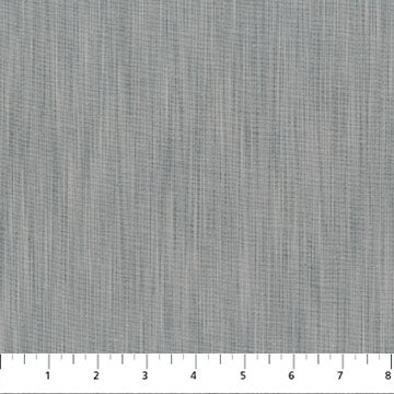 Textured gray fabric pattern with a ruler at the bottom
