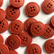 Red buttons with four holes on a white background