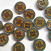 Set of round buttons with a floral pattern on a white background