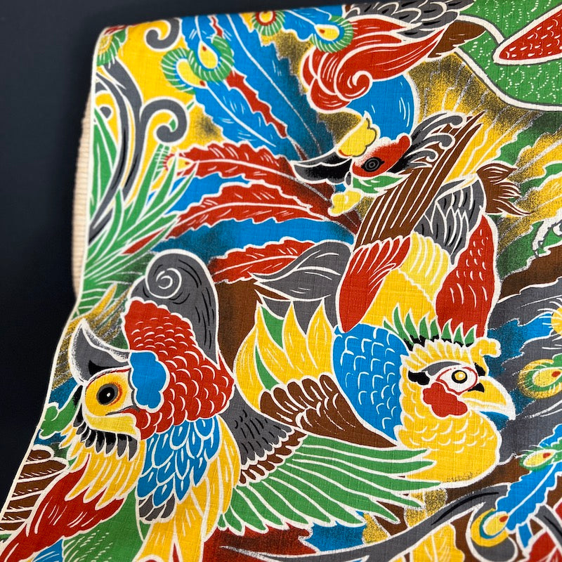 Colorful fabric with parrot design on a black background