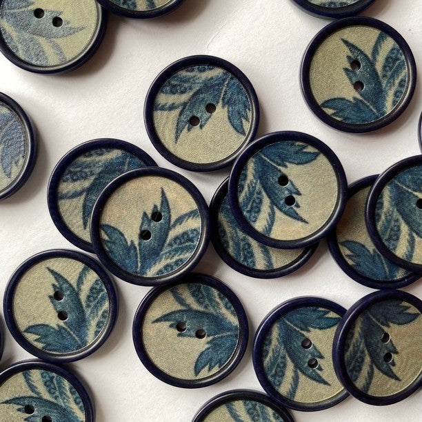 Patterned buttons with leaf design on a white background
