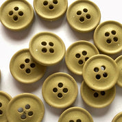 Collection of beige buttons on a white background