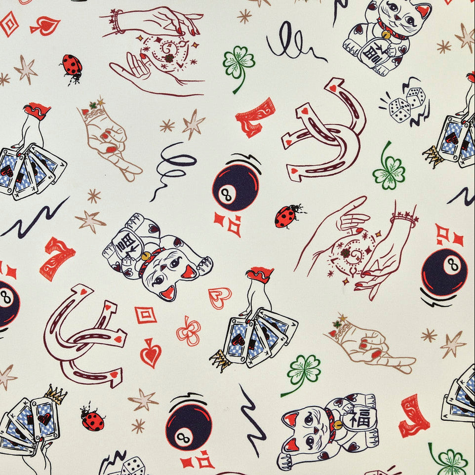 Pattern of lucky charms and symbols on a white background