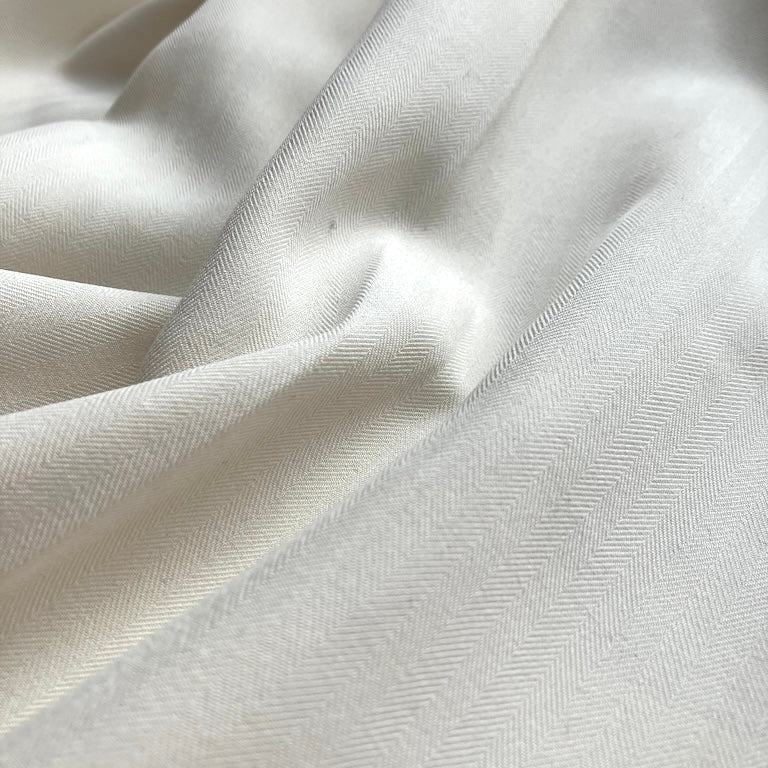 Close-up of white fabric with subtle texture