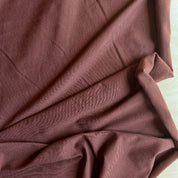 Close-up of brown fabric with folds