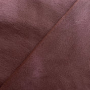 Close-up of brown fabric with a diagonal seam