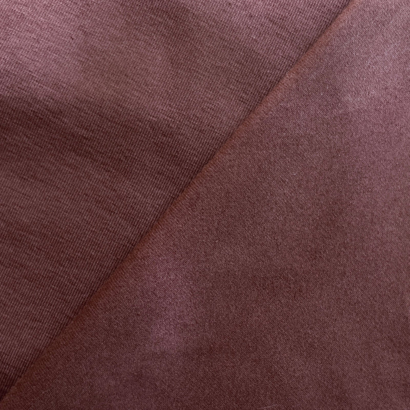 Close-up of brown fabric with a diagonal seam