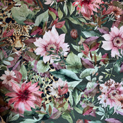 Floral and leopard pattern on a dark green background
