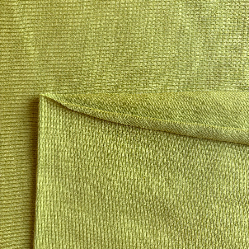 Close-up of lime green fabric with a slight texture