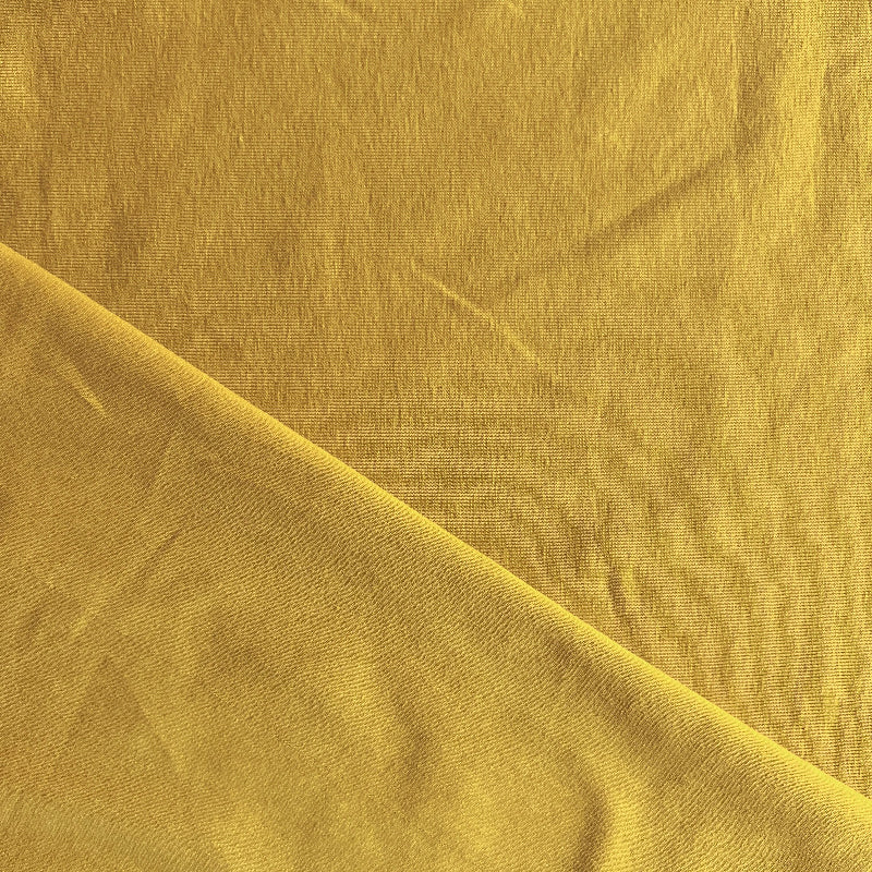 Close-up of ochre fabric with a subtle texture