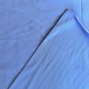 Close-up of blue fabric with a slight texture
