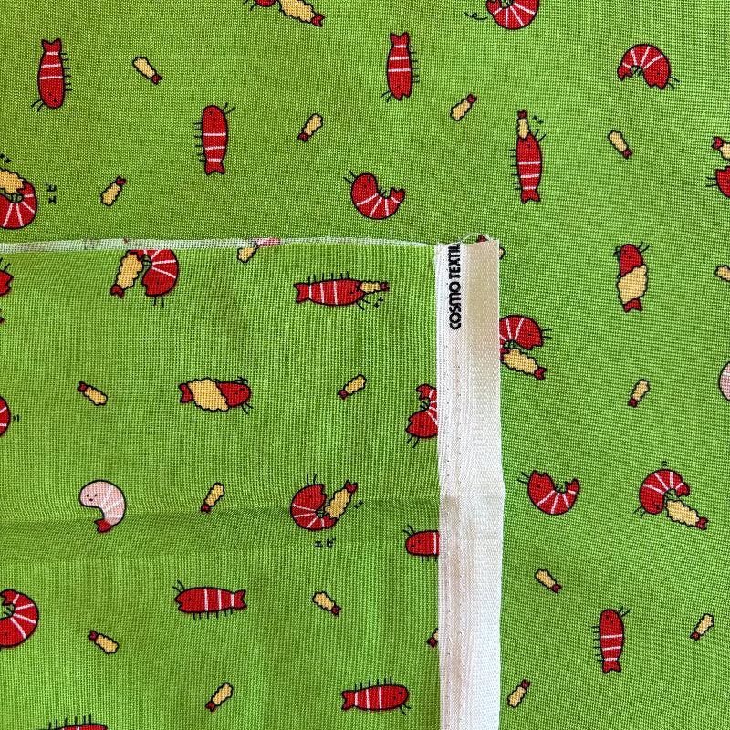 Fabric with shrimp pattern on a green background