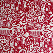 White floral and geometric pattern on a red background