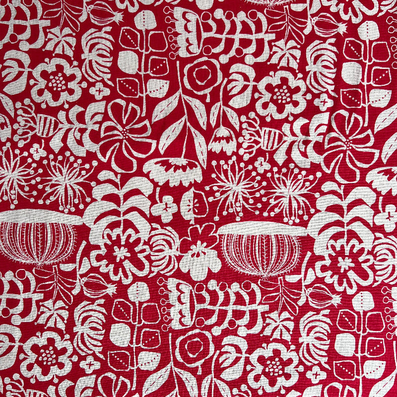 White floral and geometric pattern on a red background