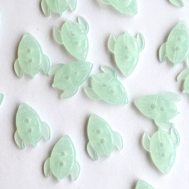 Light green rocket-shaped buttons on a white background
