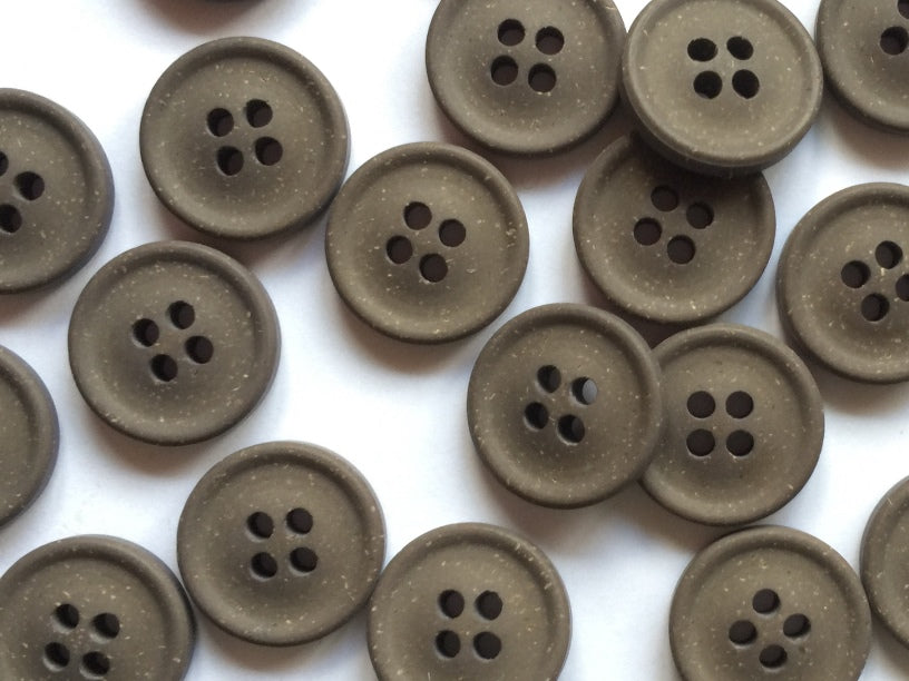 Brown buttons on a white background