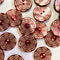 Red and white patterned buttons on a light background